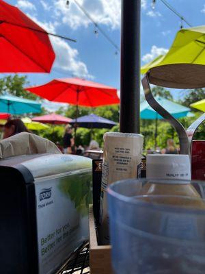 Sweet color umbrellas giving shade on the patio.