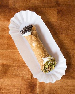 Cannoli dipped in chocolate chips and pistachios