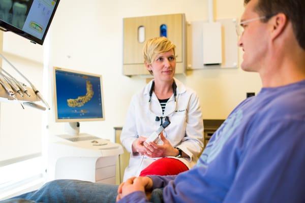 Dr. Andersen visiting with a patient about "same day" dental crowns