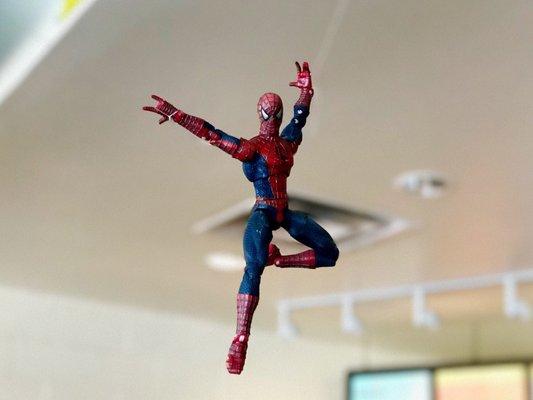 Spider-Man hanging from ceiling