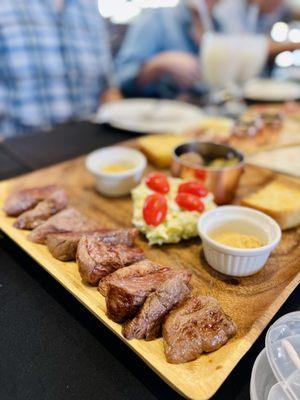 Rio sirloin cap with roasted potatoes salad and bread