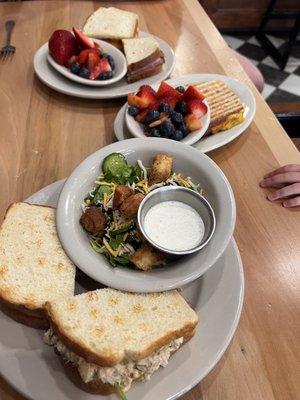 Top: classic club with fruit Middle: grilled cheese kids meal with fruit Bottom: chicken salad sandwich with a ranch side salad