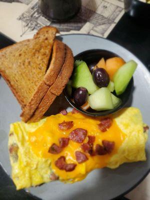 Jalapeño and Cheddar kielbasa omelet, fresh fruit and wheat toast.