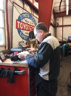 Master Technician Pat Tucker working on odometer replacement