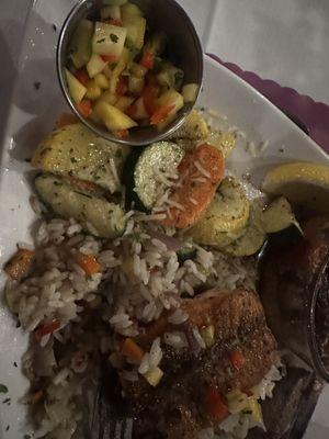 Salmon with rice pilaf and fresh veggies.