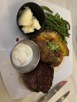 Filet mignon and loaded baked potato