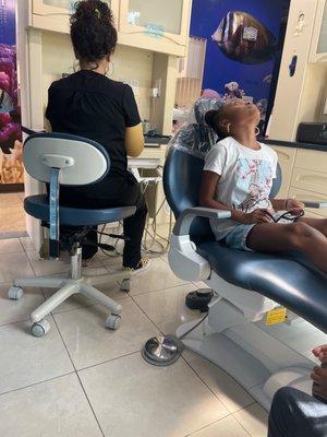 My daughter getting teeth cleaned