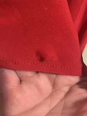 This is one of many black stains on the $208 dress that were not there when we purchased this dress from Nadia S Evening in Edmonds, WA.