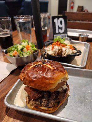 Pretzel burger, side salad, loaded tots