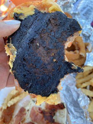 The burnt burger patty from the Wild Western Burger ...all 3 of our orders looked like this