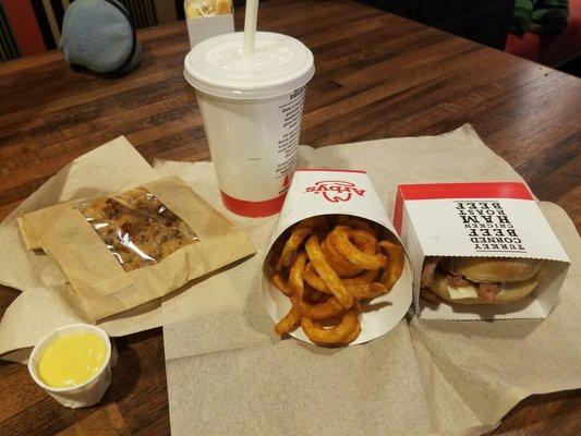 Vanilla milkshake, small curly fry, roast beef slider, and salted caramel cookie.