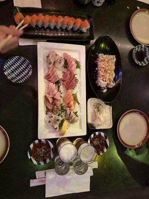 Deluxe sashimi plate with philly roll and California rolls for the kiddos.