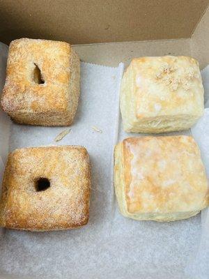 Two churro, one original glaze, one apple pie donuts