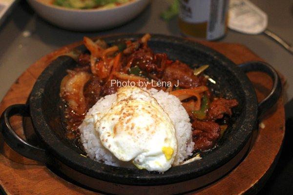 Spicy Pork Sura Hot Stone Plate Bibimbap ($21.95) - rice served on a stone plate mixed with seasoned spicy pork, assorted vegetables