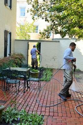 Power washing the Cottage House at the Governor's Mansion in Richmond, Virginia