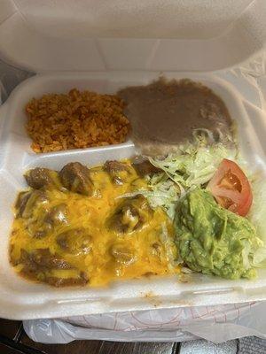 Carne guisada with cheese, rice and beans