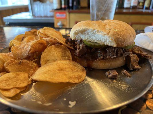 Smoked Brisket Sandwich and chips