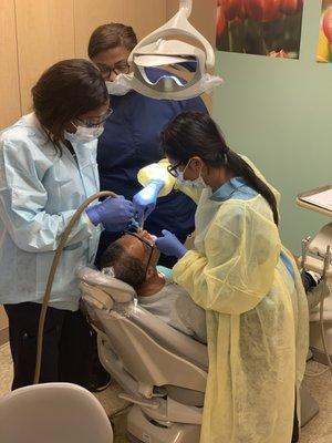 Our dental team at CAHN working collaboratively with a patient