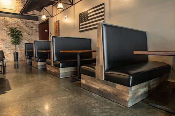 Reclaimed style plain back booths (#BT-SH-PL) and solid wood tables.