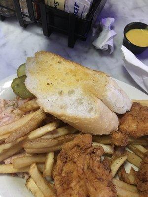 Buttered bread pulled from underneath the chicken and fries