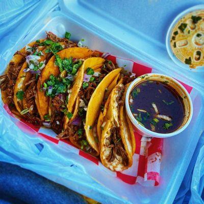 Birria tacos and consomé