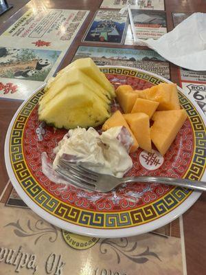 Fresh pineapple, cantaloupe, and some kind of apple dessert