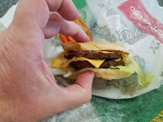 A Carl's Jr disaster of a California Double Cheeseburger..what a joke.