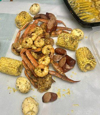 1 lb Love Butta Baked Snow Crab Clusters, 1/2 lb Shrimp, 1/2 lb Sausage, Potatoes, 1 Corn, 1 Egg Turkey Sausage