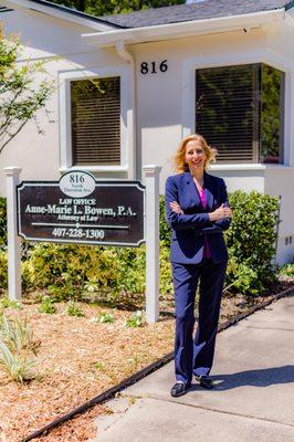 Law Office of Anne-Marie L. Bowen, P.A. with Attorney Bowen standing near the sign at the front of the office building.