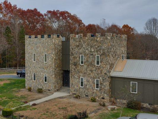 Stone repair had to take all the stone off this house. Then after they repaired water damage relaid new stone.