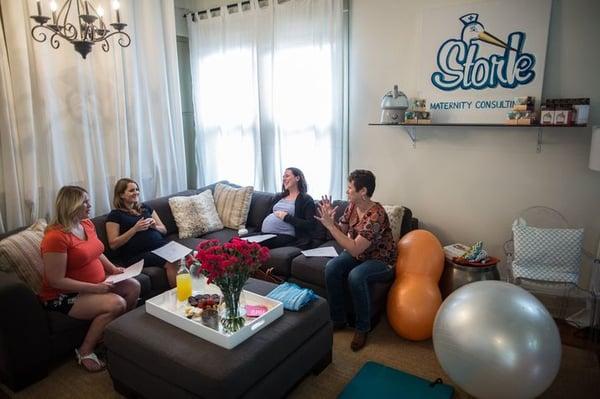 April Blackmore, right, Stork doula, leads a centering circle on comfort measures during childbirth at Stork Maternity Consulting.