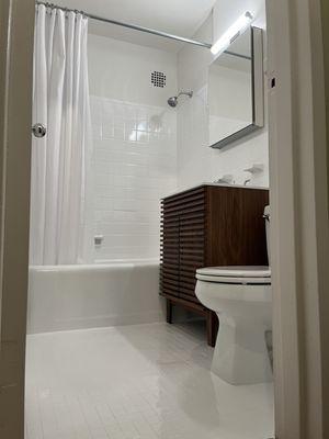 Bathroom walls, floors, tub, toilet, sink