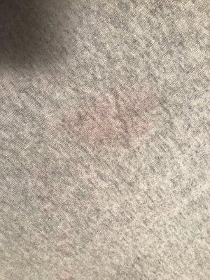 Pink stains all over sweater