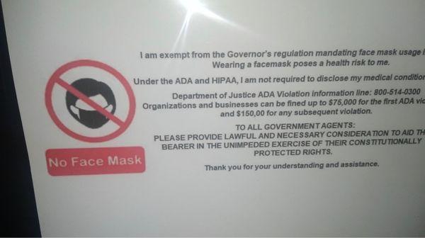 Anti mask sign posted at Engle automotive.