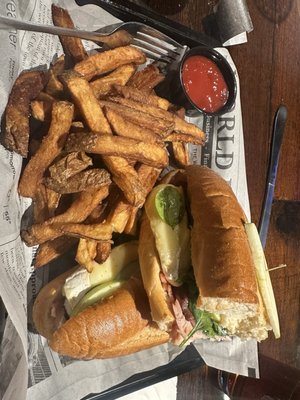 Turkey Orchard sandwich (Turkey, bacon, Brie cheese, spinach, and apples) with house made fries.