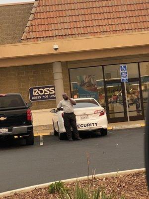 Security  Not paying attention to customers or the parking lot. Just talking on his phone and not paying attention to what's going on