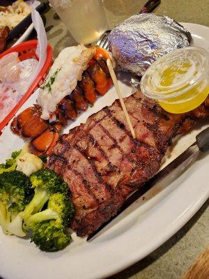 Steak & lobster, baked tater & veggies