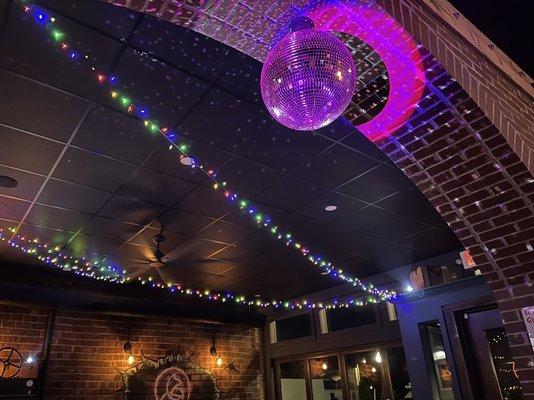 Disco ball in the middle of the dining and bar area.