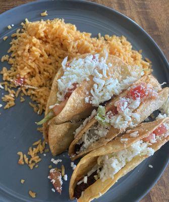 Fried beef tacos and rice.