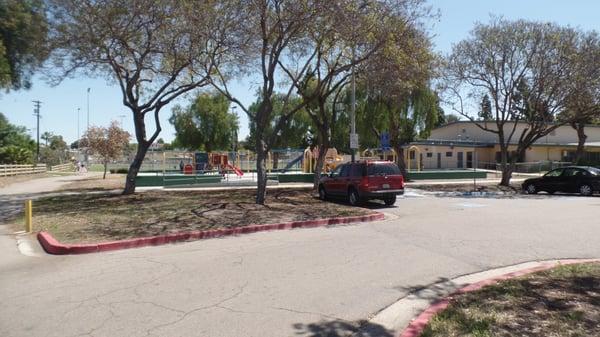 Parking lot overlooking children's playground. Plenty of shade trees to keep mom & dad, and car cool during warm days. Enter off So. 40th St