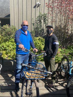 My husband on left and Kenny, Village Cycle owner on right