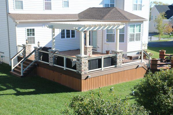 Trex deck, Almond Vinyl pergola with stone columns - West Chester PA