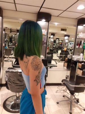 Dark blue roots mixed with blue and green hair