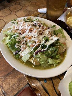 Carnitas enchilada with green sauce