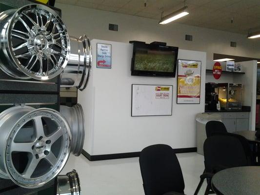 A place to sit and wait, a nice tv, coffee and popcorn. Vending snacks on the other side.