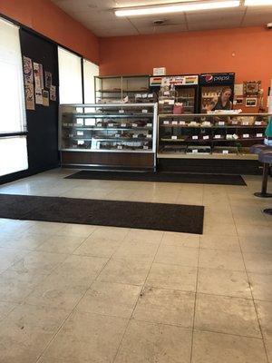 Counter area of delicious freshly made donuts.