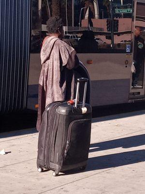 Smelly lady getting on the bus.