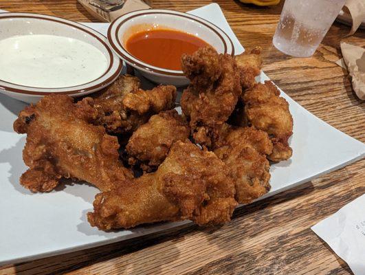 Naked wings with extra hot buffalo sauce on the side