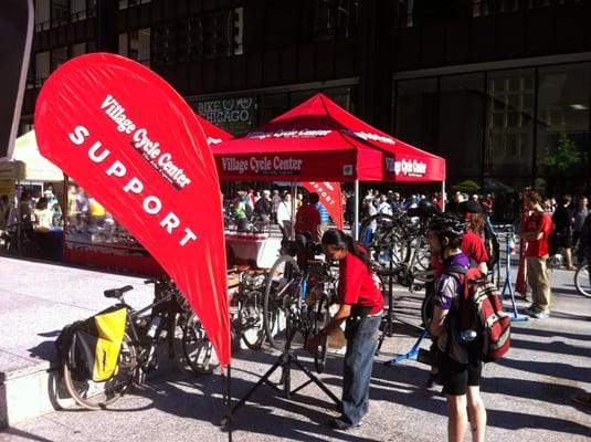 Village Cycle Center at the 2013 Chicago Bike to Work Rally helping out cyclists.