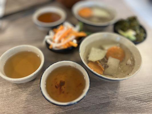 Soup and pickles for broken rice dish